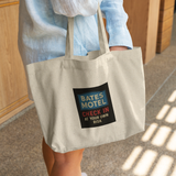 Bates_Motel_Check_In_at_Your_Own_Risk_To_CottonTote_L_WomanDigging_Mockup.png